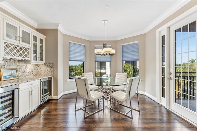 dining space with bar area, beverage cooler, and dark hardwood / wood-style flooring