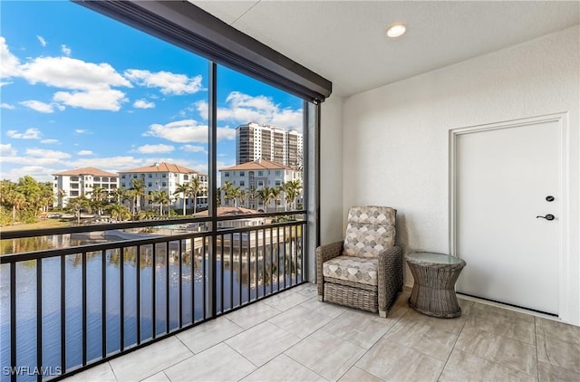 balcony featuring a water view