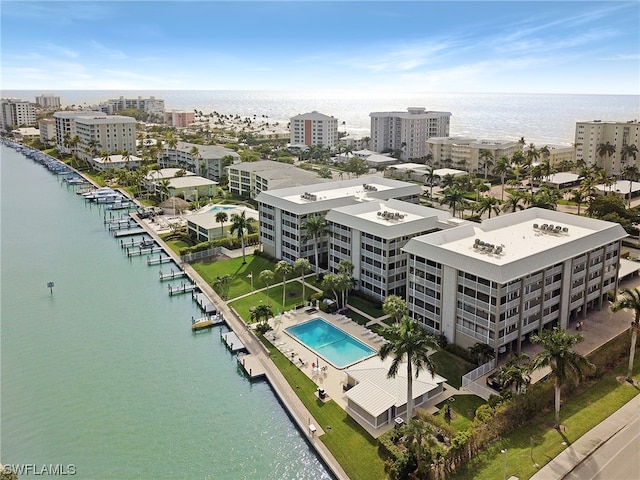 birds eye view of property featuring a water view