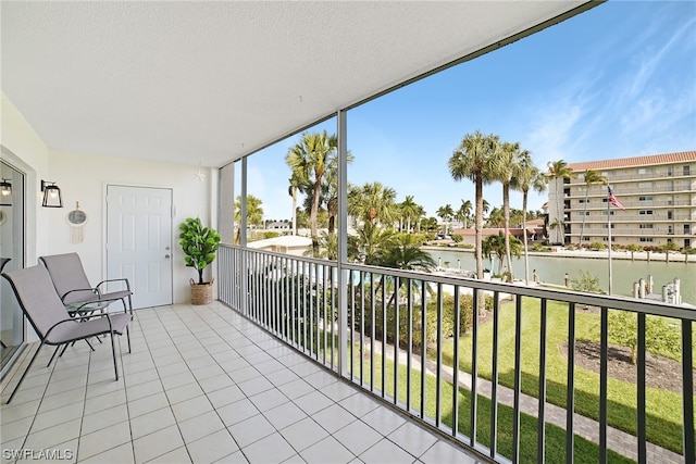 balcony featuring a water view