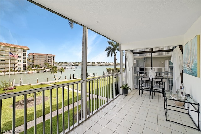 balcony featuring a water view