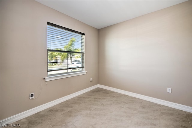 spare room with light tile flooring