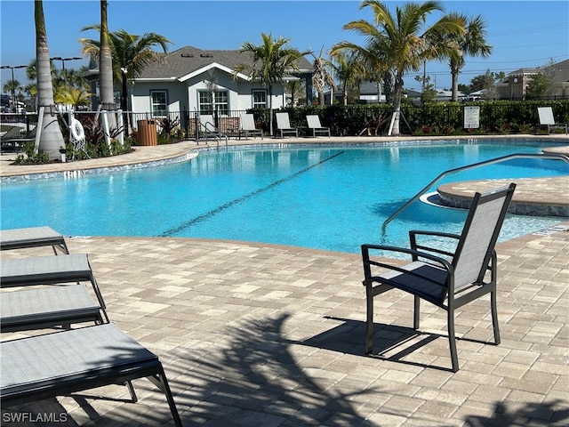 view of swimming pool featuring a patio area