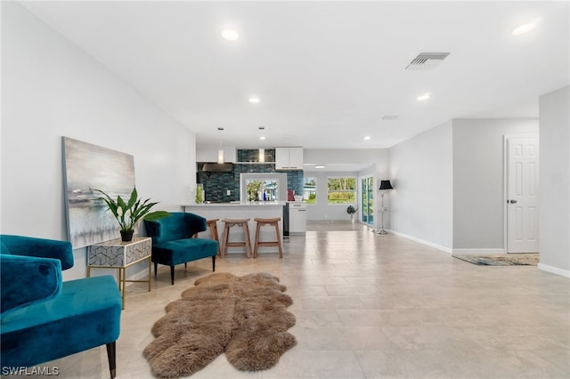 living area with light tile patterned floors