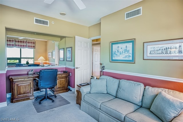 office featuring light carpet and ceiling fan