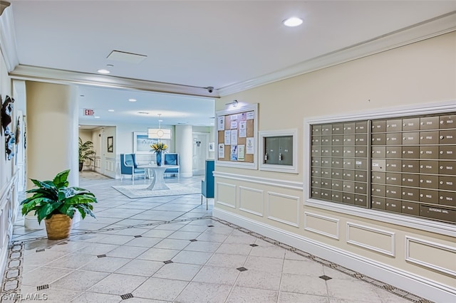 interior space with light tile floors, crown molding, and a mail area