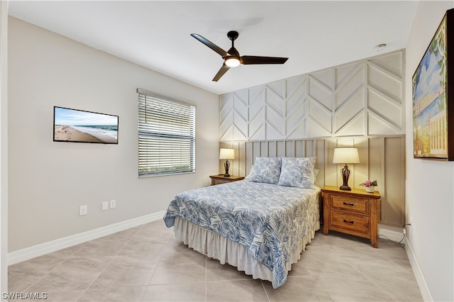 tiled bedroom featuring ceiling fan