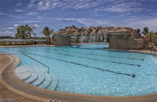 view of pool featuring pool water feature