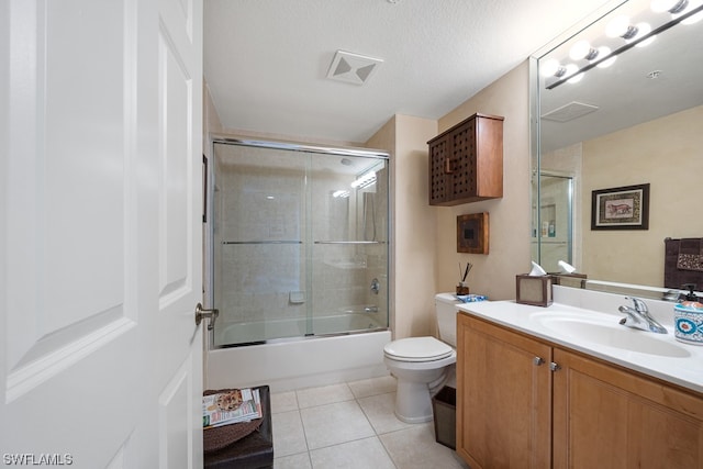 full bathroom with vanity, toilet, enclosed tub / shower combo, and tile patterned flooring