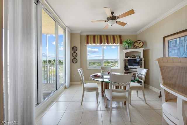 dining space with light tile patterned floors, ceiling fan, and ornamental molding