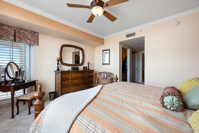 bedroom featuring ceiling fan, light colored carpet, and crown molding