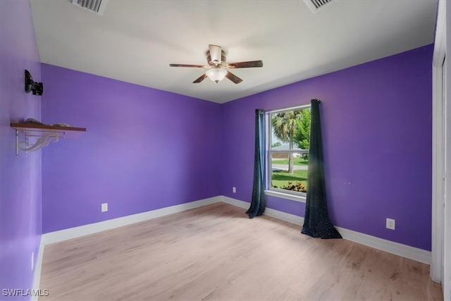 spare room featuring ceiling fan and light wood-type flooring