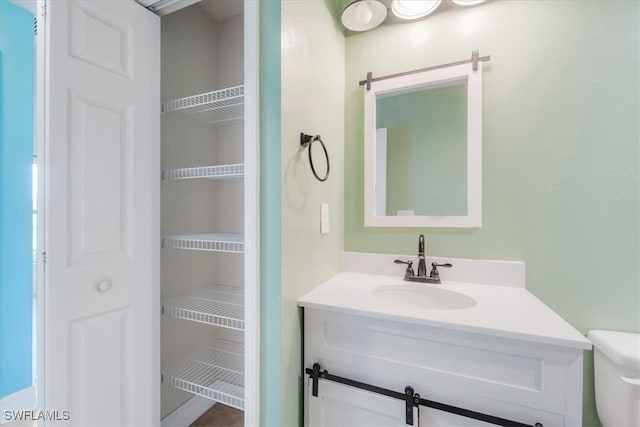 bathroom with vanity and toilet