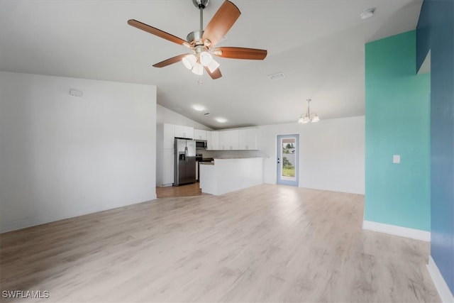 unfurnished living room with light hardwood / wood-style flooring, ceiling fan with notable chandelier, and lofted ceiling