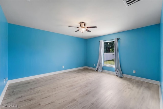 unfurnished room featuring ceiling fan and light hardwood / wood-style flooring