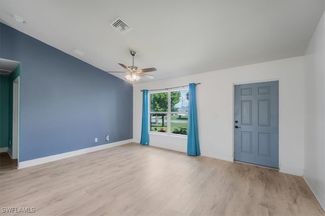 spare room with ceiling fan and light hardwood / wood-style flooring