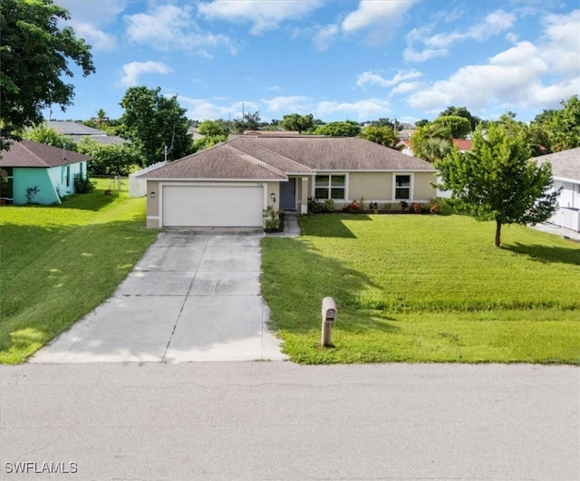 single story home with a garage and a front lawn