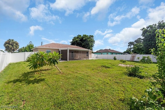 view of yard with a sunroom