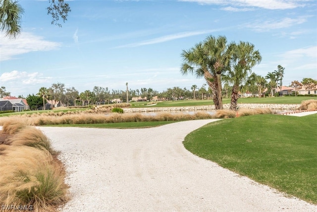 view of home's community with a lawn