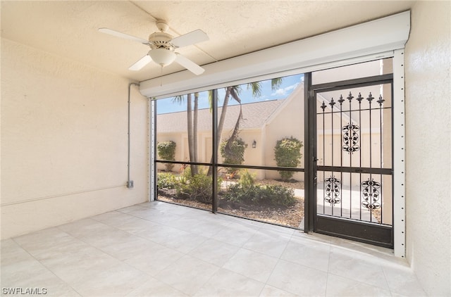 entrance to property with ceiling fan