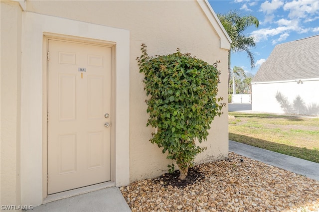 entrance to property with a yard