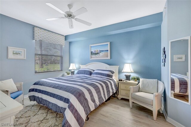 bedroom featuring ceiling fan and light hardwood / wood-style flooring