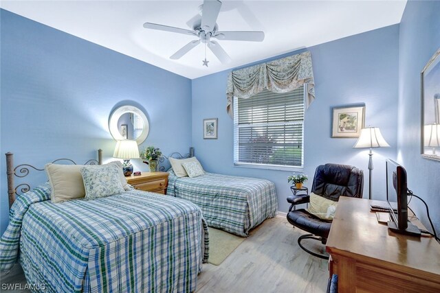 bedroom featuring ceiling fan and light hardwood / wood-style flooring