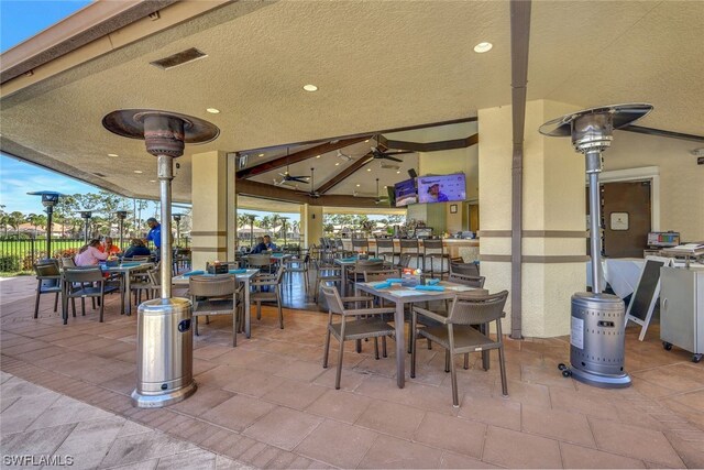 view of patio featuring ceiling fan