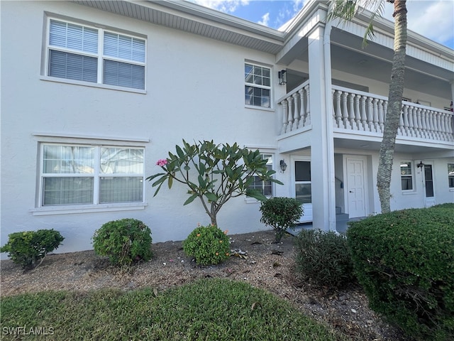 view of home's exterior featuring a balcony