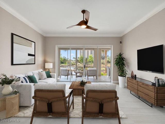 living room featuring crown molding, ceiling fan, and light hardwood / wood-style floors