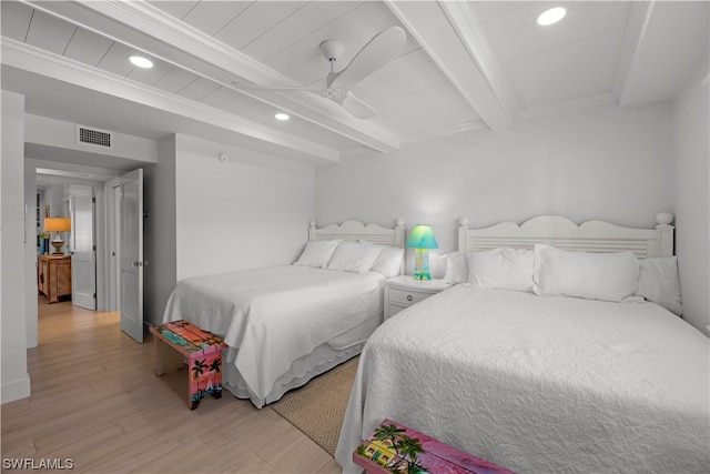 bedroom with crown molding, ceiling fan, light hardwood / wood-style flooring, and beam ceiling