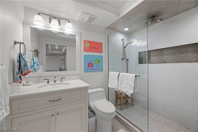 bathroom featuring vanity, a shower with shower door, and toilet