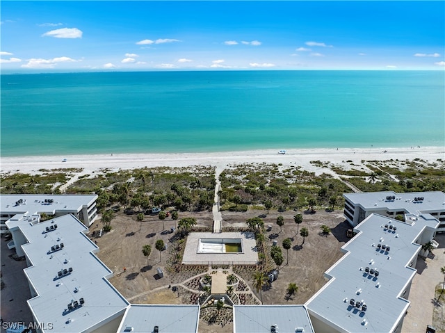 birds eye view of property with a view of the beach and a water view