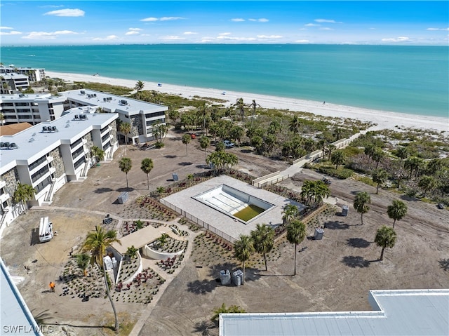 aerial view featuring a water view and a beach view