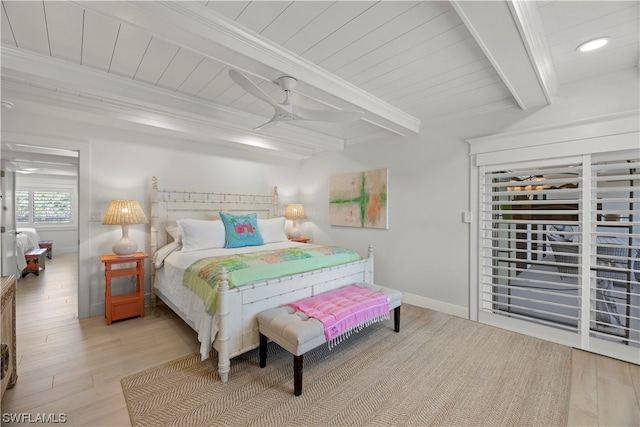 bedroom featuring crown molding, beam ceiling, ceiling fan, and light hardwood / wood-style flooring