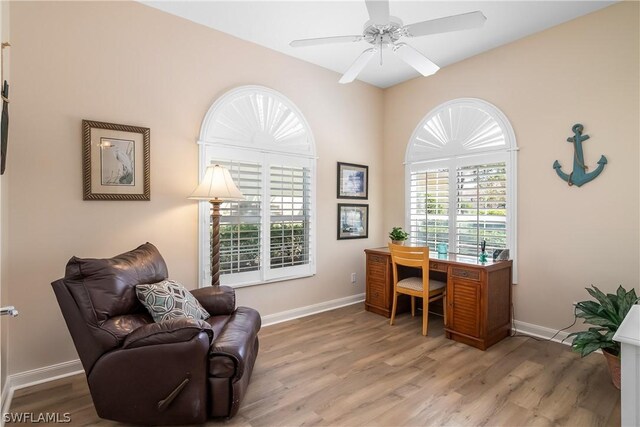 office with ceiling fan and wood-type flooring