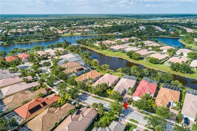 bird's eye view featuring a water view and a residential view