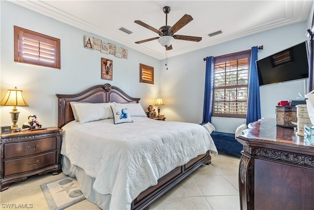 tiled bedroom with ceiling fan and ornamental molding