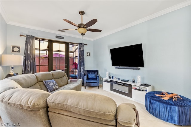 living room with ceiling fan, french doors, and ornamental molding