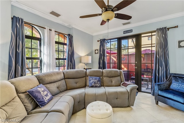 tiled living room with a wealth of natural light, ceiling fan, and ornamental molding