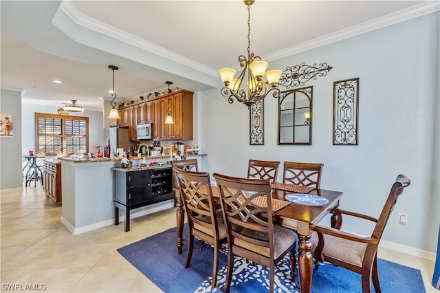 dining area featuring light tile patterned floors, ornamental molding, and a notable chandelier