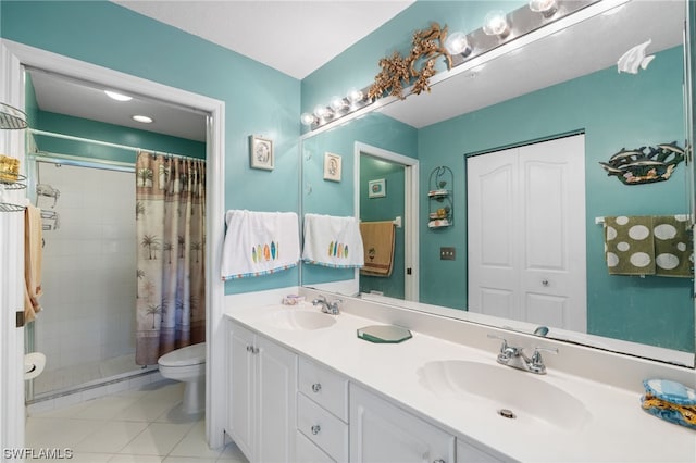 bathroom featuring toilet, large vanity, a shower with curtain, tile flooring, and dual sinks