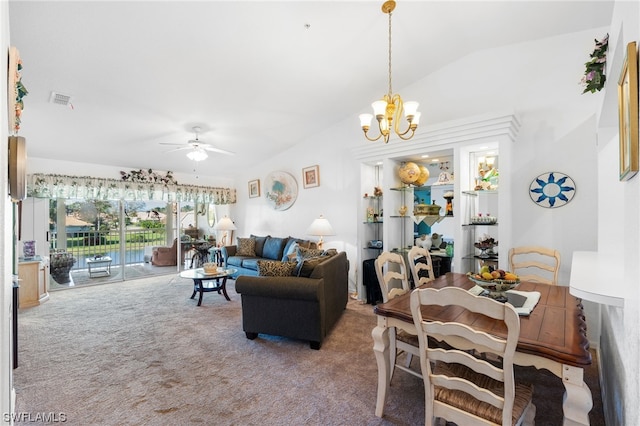 carpeted living room with ceiling fan with notable chandelier and vaulted ceiling