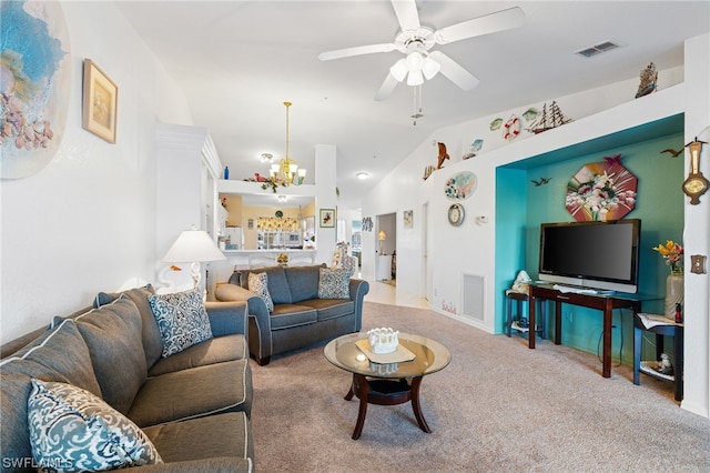 living room with lofted ceiling, light colored carpet, and ceiling fan with notable chandelier