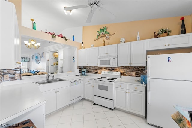 kitchen featuring backsplash, white appliances, white cabinetry, and ceiling fan with notable chandelier