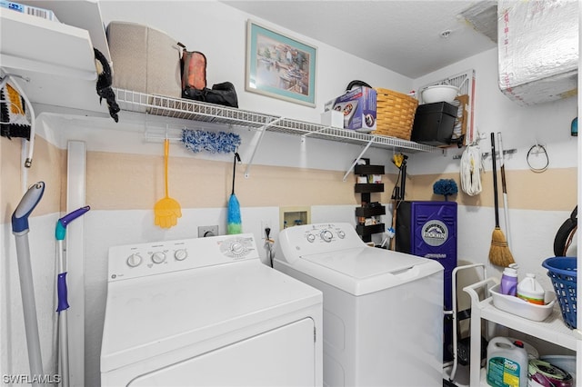 clothes washing area featuring independent washer and dryer and hookup for a washing machine