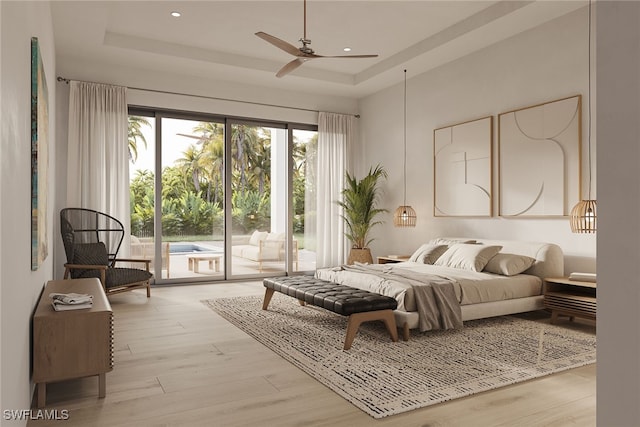 bedroom featuring light wood-type flooring, a tray ceiling, ceiling fan, and access to exterior