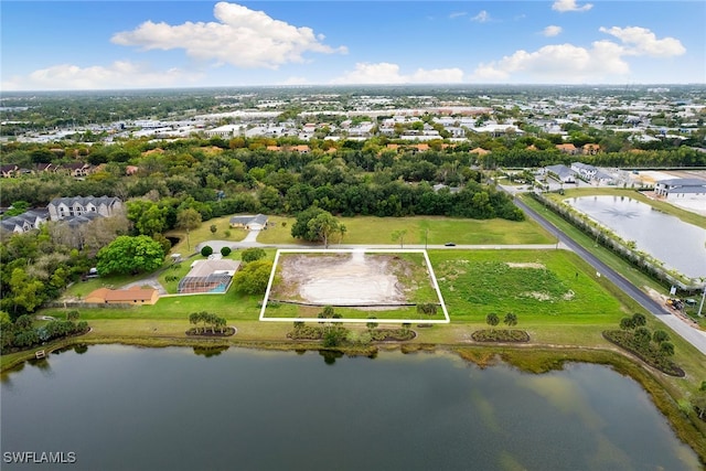 birds eye view of property featuring a water view