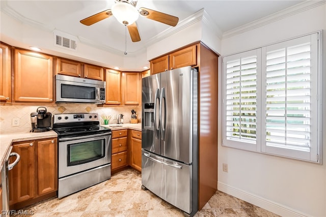 kitchen with stainless steel appliances, light tile flooring, ceiling fan, tasteful backsplash, and ornamental molding