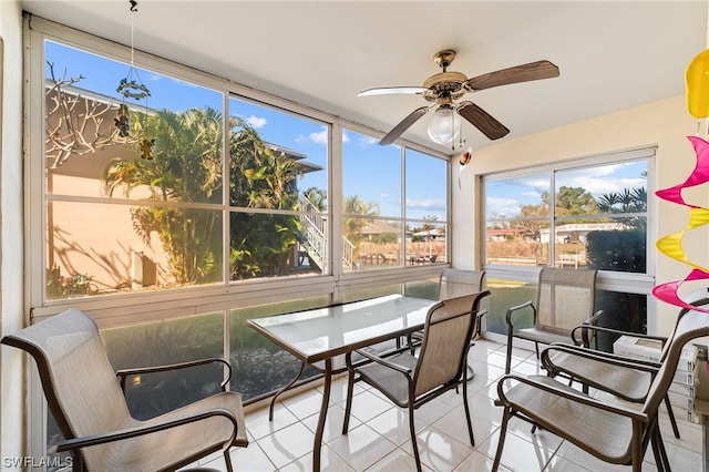 sunroom featuring ceiling fan